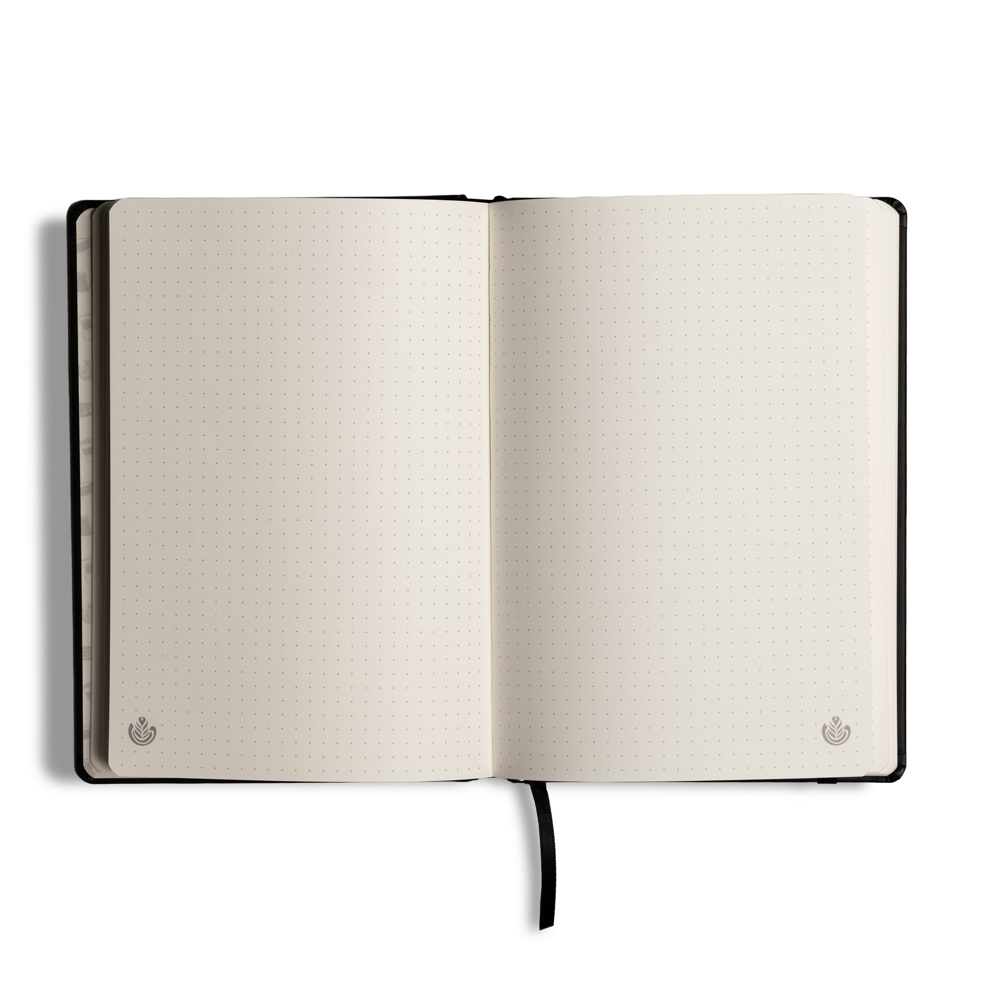 An open bullet journal with blank, dotted off-white pages, a black hardcover, and a black ribbon bookmark, shown on a clean white background.