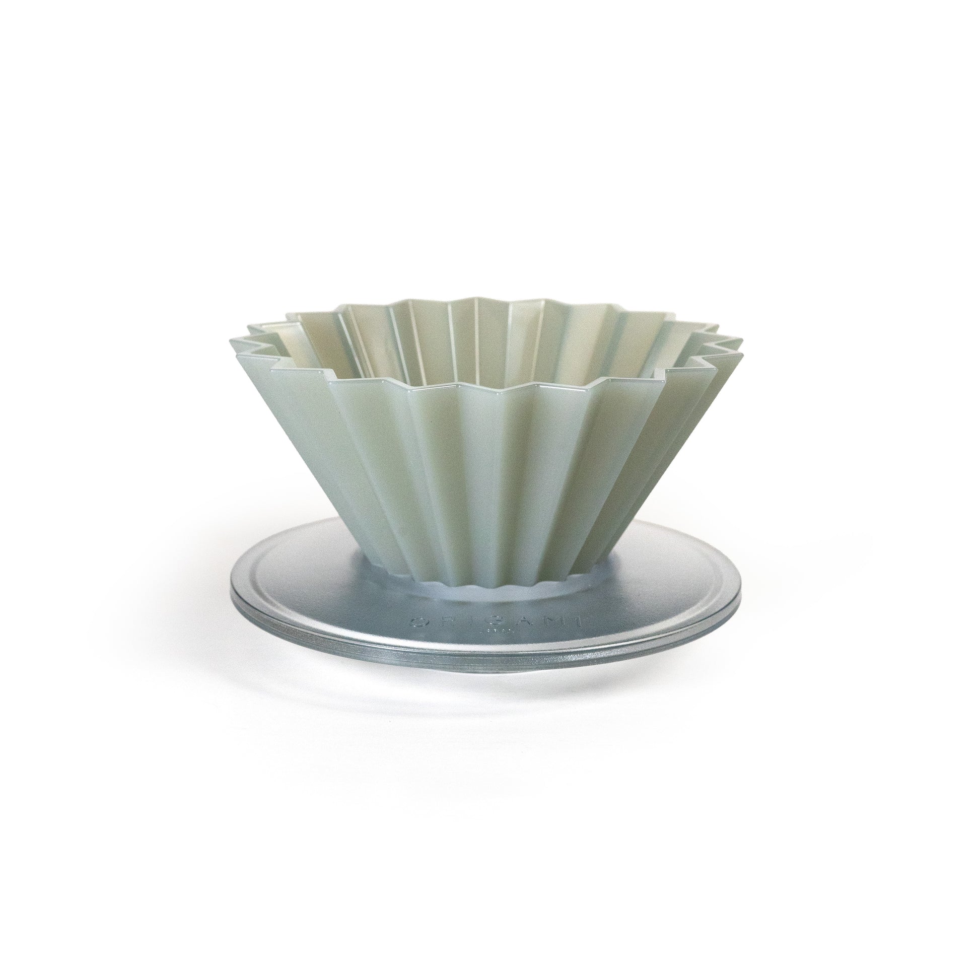 Matte grey fluted pour over dripper on a white background.