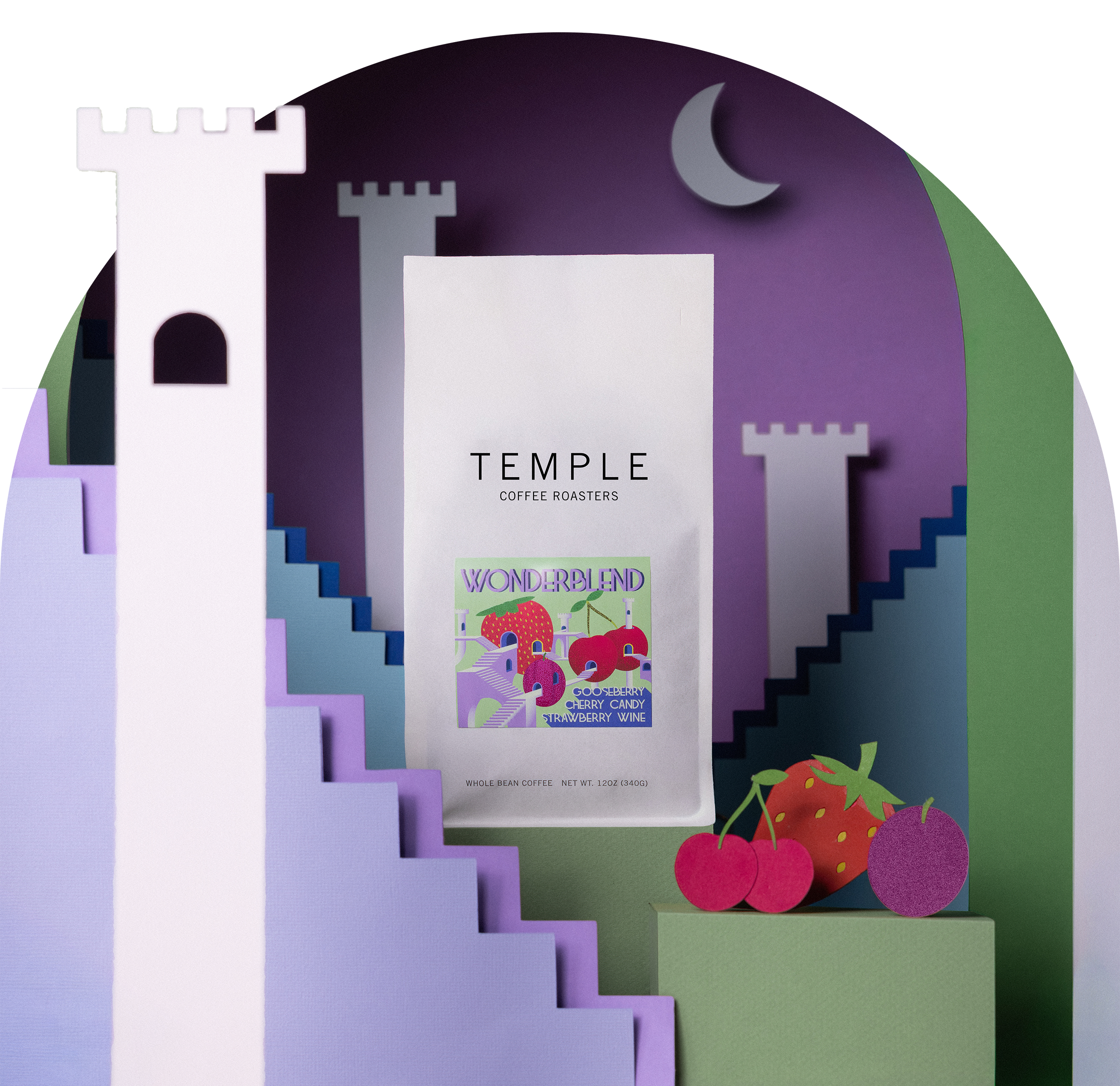 A bag of Temple Coffee Roasters 'Wonderland' coffee sits centered in a stylized, layered paper-cut scene featuring castle towers, purple and green hills, a crescent moon, and fruit shapes on a white background.