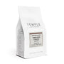 A white stand-up coffee bag from Temple Coffee Roasters on a clean white background. The front label reads 'Roaster's Choice Timor-Leste Ermera' with additional flavor text below.