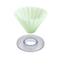 An Origami cone-shaped silicone mold in an off-white color, shown with its clear plastic circular base on a solid white background.