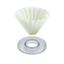 An Origami cone-shaped silicone mold in an off-white color, shown with its clear plastic circular base on a solid white background.